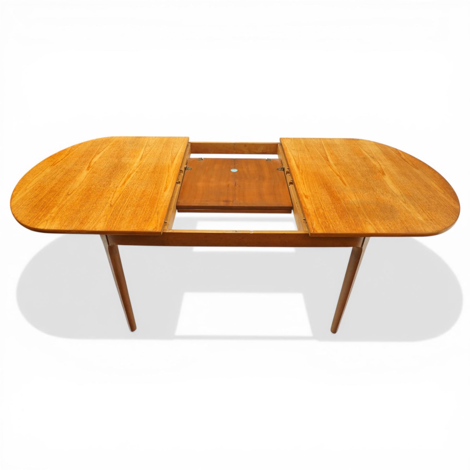 Nathan - teak oval extending dining table, together with set of eight matching low-back dining chairs with tan leather seats, extends to 203cm