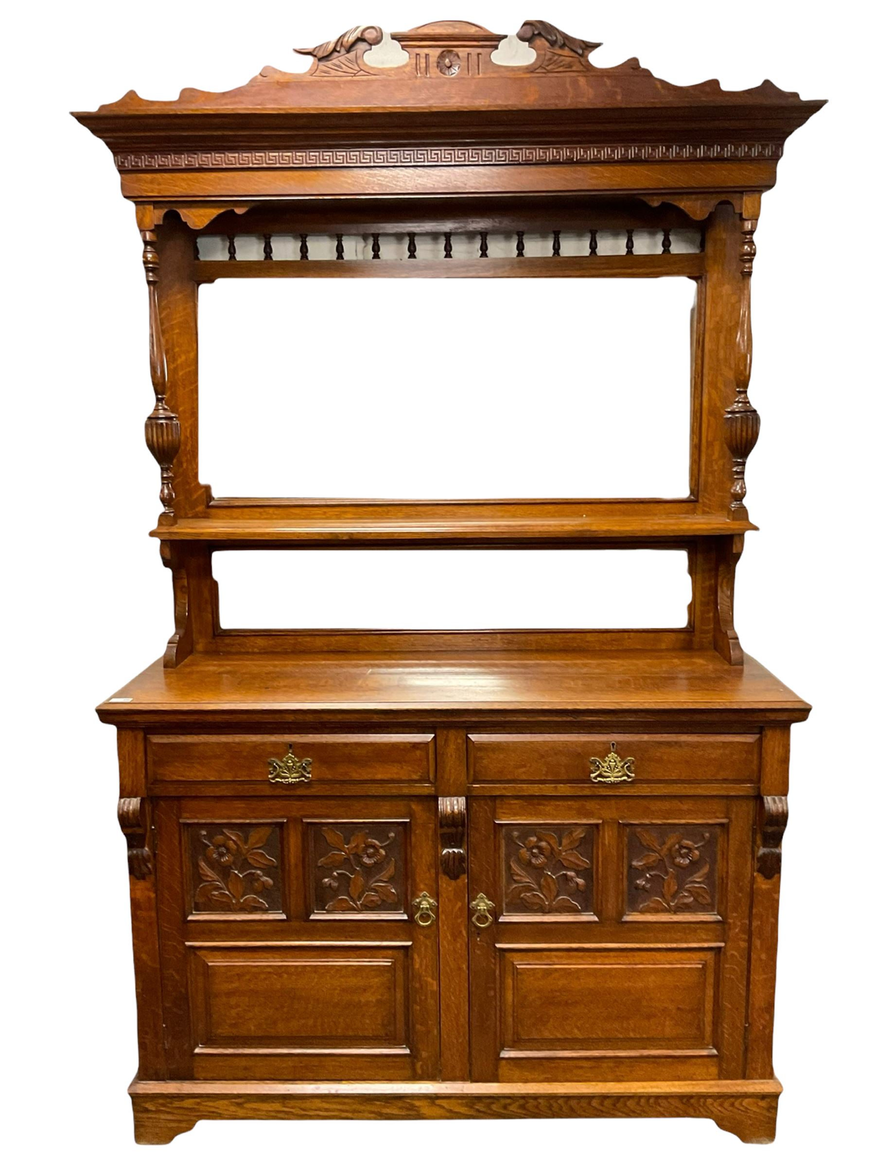 Edwardian oak mirror back sideboard, raised shaped pediment carved with acanthus leaves over Greek key frieze, bevelled mirror back, fitted with two drawers and two cupboards