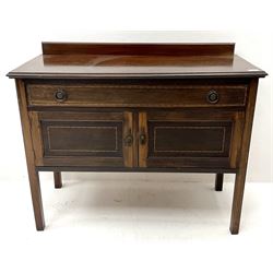 Early 20th century inlaid mahogany dressing chest, raised oval mirror back, two short and two long drawers (W107cm, H150cm, D47cm) and a matching washstand, single drawer, two cupboards (W99cm, H81cm, D44cm)