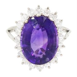 18ct white gold oval cut amethyst and round brilliant cut diamond cluster ring, amethyst approx 5.55 carat, total diamond weight approx 0.60 carat