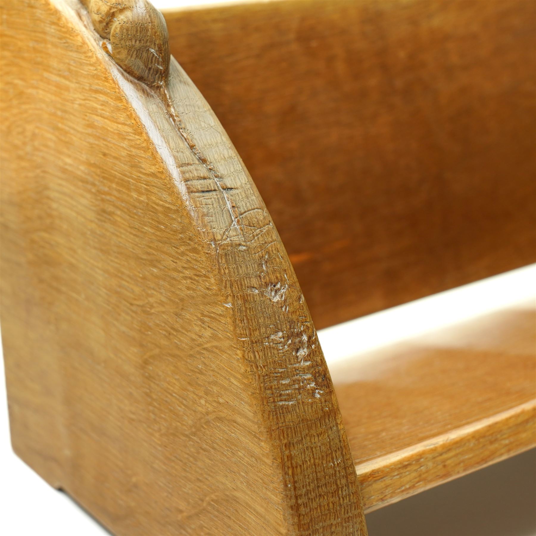 Mouseman - oak book trough, curved end supports, with carved mouse signature, by the workshop of Robert Thompson, Kilburn W46cm