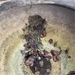 Large 19th century circular stone mortar planter on wrought iron stand