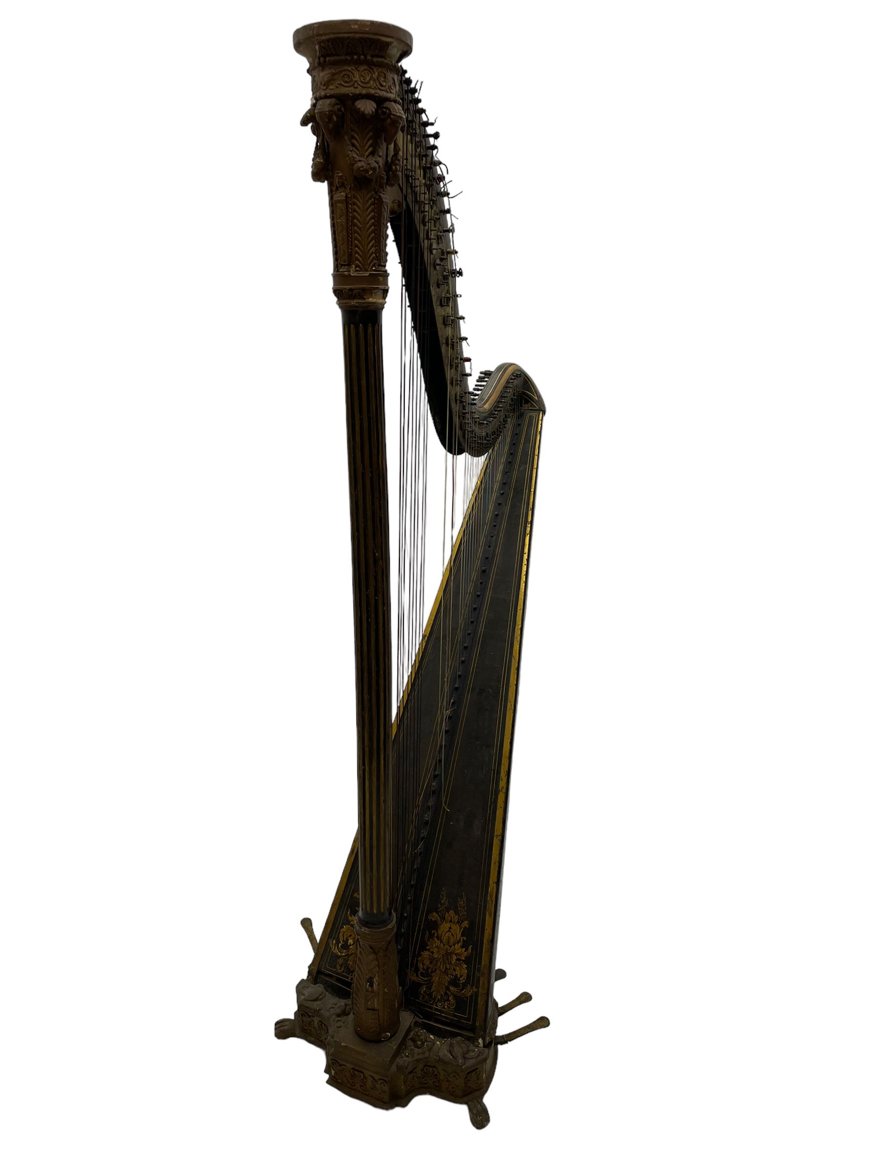 J. Erat. Wardour Street, London, Soho - Regency parcel-gilt and rosewood finish pedal harp, forty-three strings and five swell doors, the fluted pillar decorated with rams head capital, floral festoons, anthemion motifs and sarcophagi, the base decorated with pharaonic motifs and fitted with eight brass pedals, on carved paw feet, brass signature plate to top inscribed 'J. Erat. Wardour Street, London, Soho, 606'