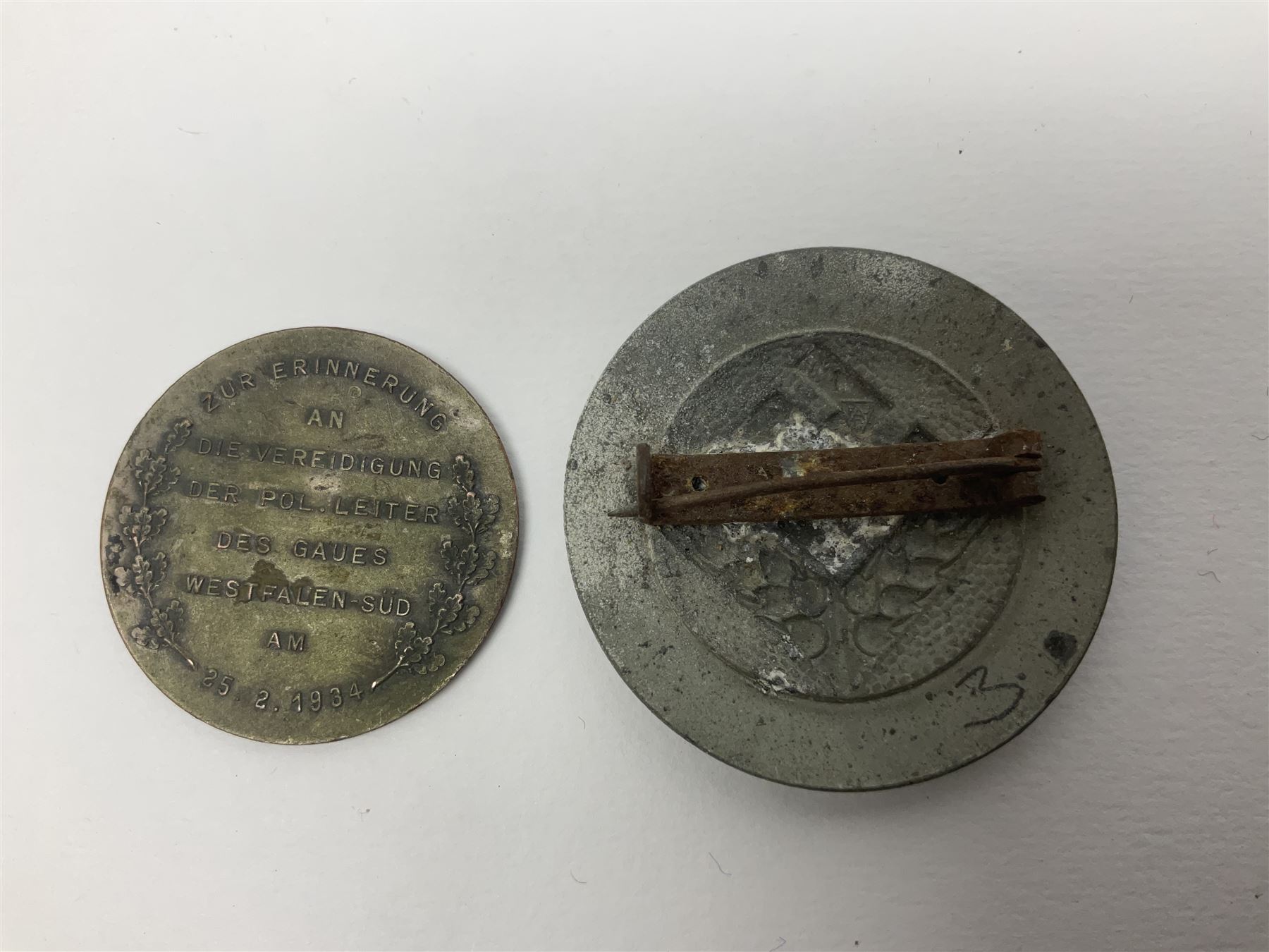 Five WW2 German medals/badges -German Defences West Wall Medal, War merit Cross, Red Cross Decoration, RAD tinnie brooch and Adolf Hitler 1934 medallion (5)