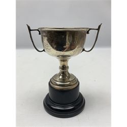 1930's silver twin handled trophy cup, upon black circular plinth, hallmarked Birmingham 1936, approximate silver weight 47 grams