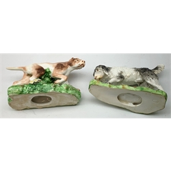 Two 19th century Staffordshire models of hunting dogs, each stood upon naturalistically modelled bases, tallest H12cm, longest L15cm