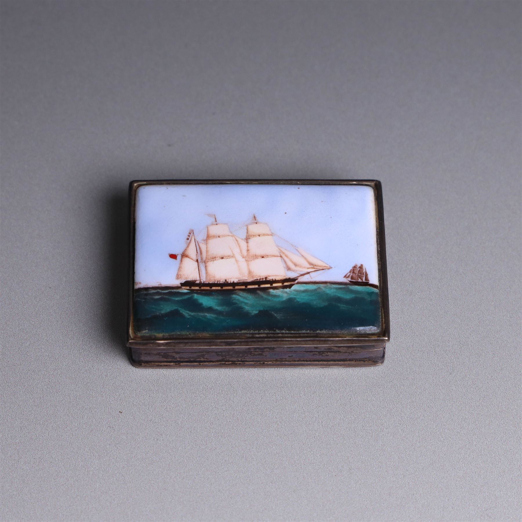 Modern silver box, with enamel plaque to hinged lid depicting a ship at full sail, stamped 925