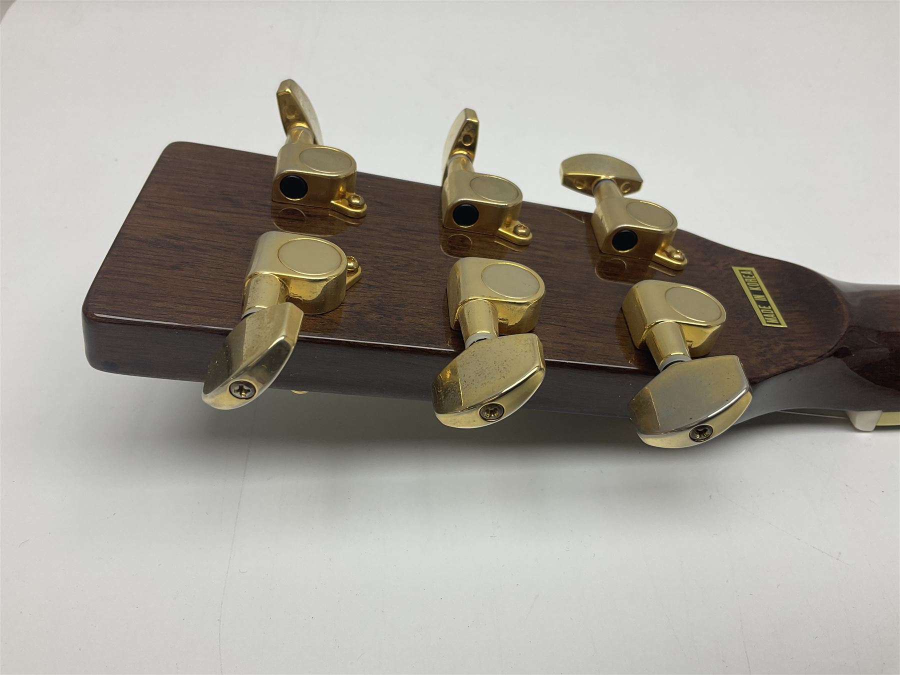 Ozark metal cased resonator guitar with all over chased foliate decoration to the polished finish and mother-of-pearl inlay to the fretboard L100cm; in Stagg hard carrying case