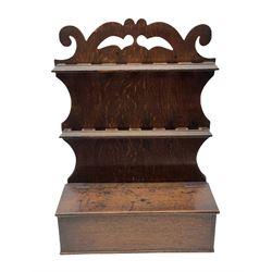 George III oak spoon rack and candle box, the shaped back with scroll crest, and two six aperture spoon racks, above a candle box enclosed by a sloped hinged lid, H54.5cm, W38cm, D13cm