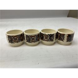 Collection of 1970s Hornsea mugs designed by John Clappison, comprising six Train Robber pattern examples together with owl patterned example on dark teal ground, and further example decorated with stylised hen and chick and egg, approx 9cm, together with four small cup bowls, all with stamped Hornsea marks beneath