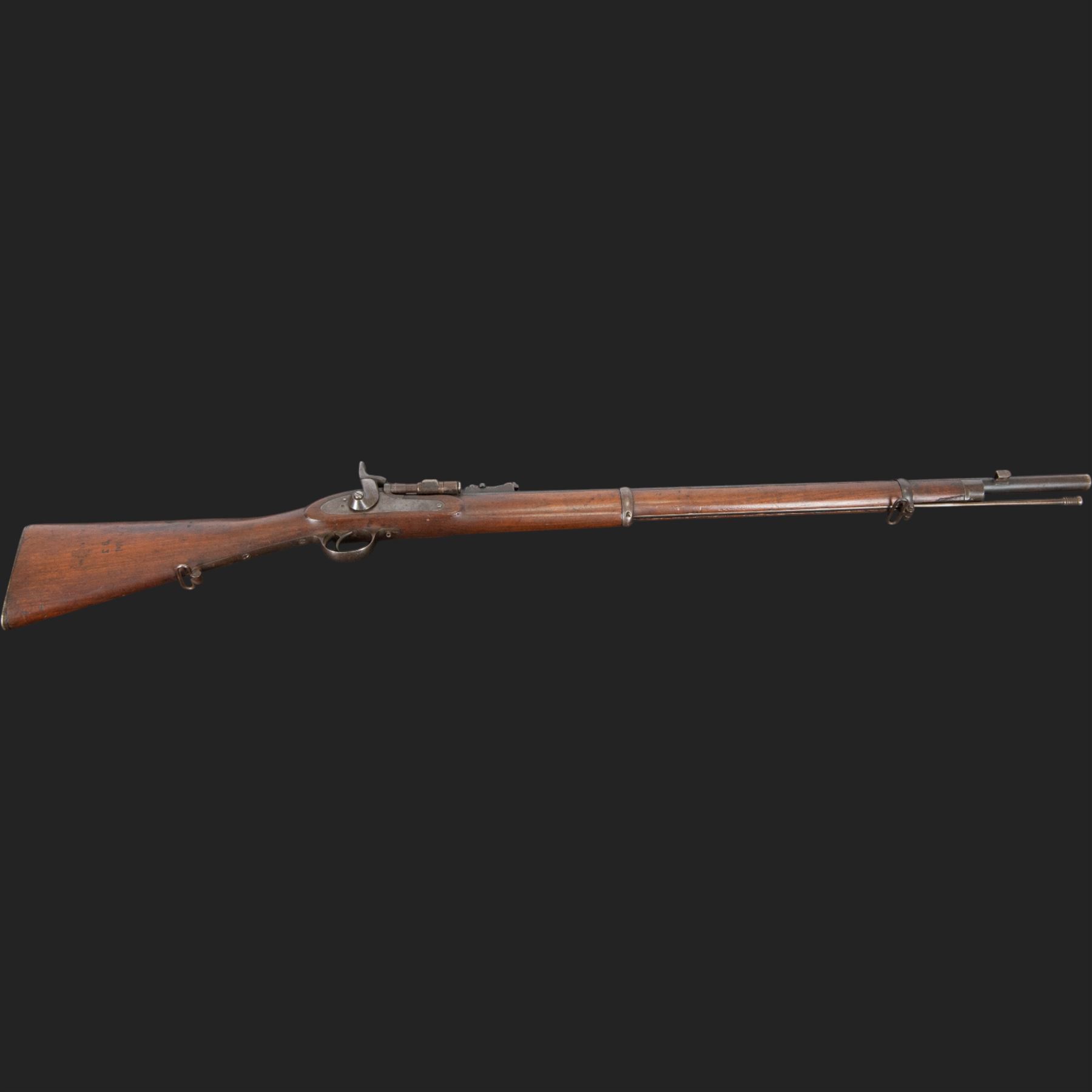 Snider-Enfield service rifle .577 calibre, barrel 33 in., tangent/ladder back sight, action marked with crowned V.R BSA & Co 1872, full stocked with two barrel bands, steel clearing rod, walnut stock marked Mx1 93 Birmingham, overall L124cm