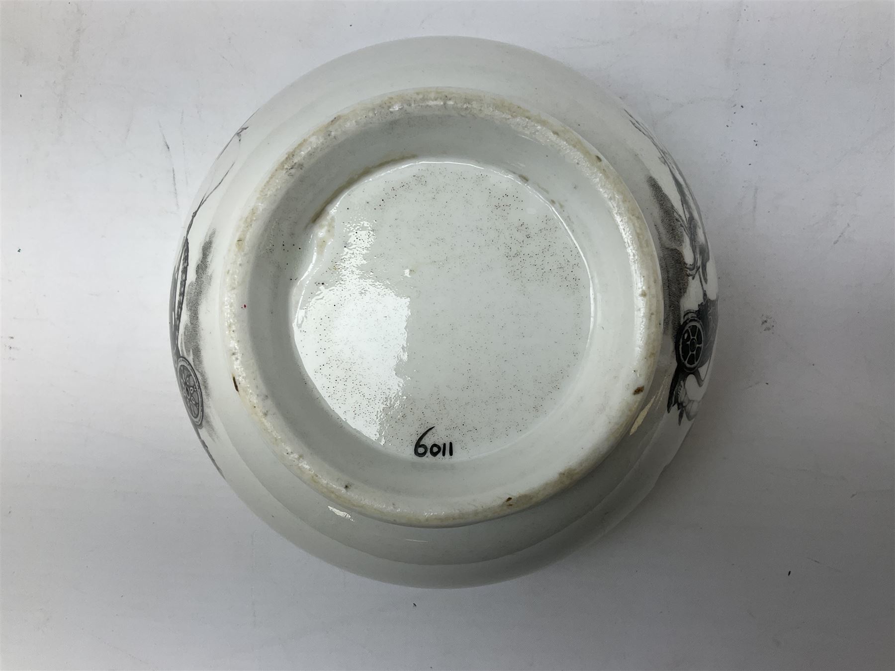 Early 19th century Staffordshire bat printed part tea service, decorated in black after Adam Buck with scenes of mother and child and other varying classical style scenes, within black bands, comprising teapot, slop bowl, jug, seven teacups and five saucers 