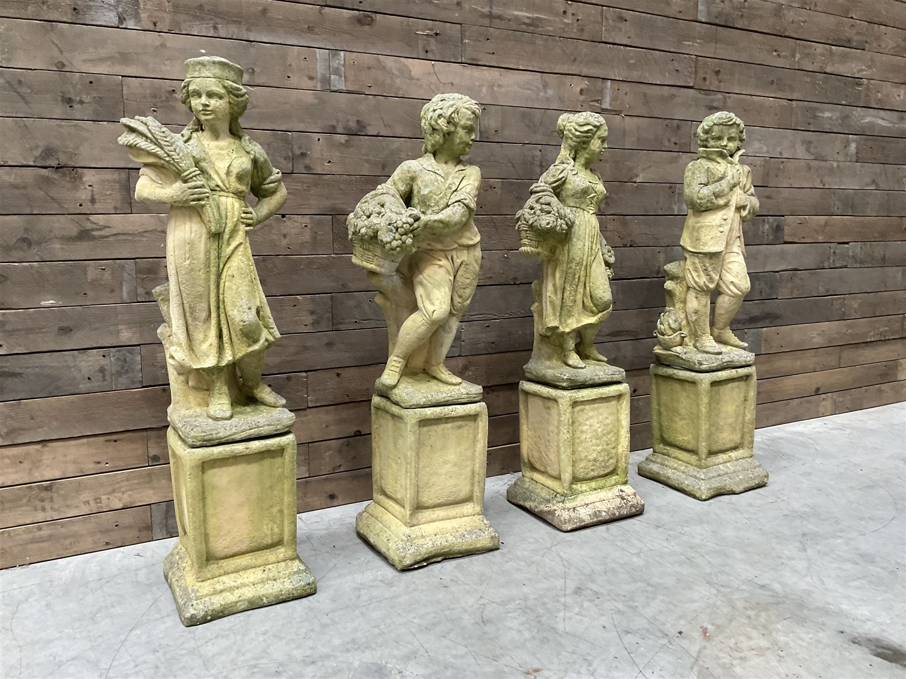 The Four Seasons - set of four cast stone garden figures on plinths