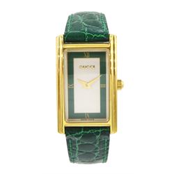 Gucci ladies gold-plated quartz wristwatch, Ref. 2600 L, silvered and green dial, on original green leather strap with gilt buckle, boxed