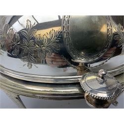 Silver plated warming entree dish of oval form with revolving engraved cover, the interior fitted with pierced lift out tray housed above another lift out tray, raised on four tapering legs with foliate decoration