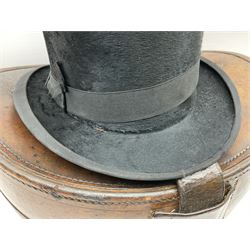 Early 20th century black silk top hat by Woodrow of Manchester and London, with manufacturer's stamp to the silk lined interior, housed in fitted tan leather hat box with removable internal compartments with straps, brass escutcheon and engraved plaque, hat internal measurements approx 20cm x 15cm