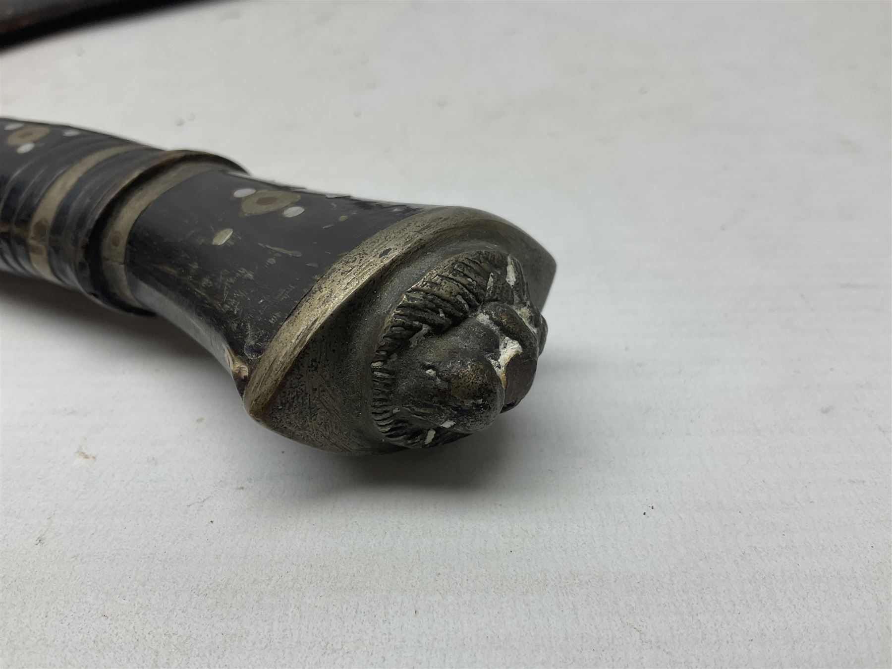 Indian kukri with 29cm curving steel blade and nickel mounted horn grip; in leather covered scabbard with one skinning knife L42cm overall; Hitler Youth knife with scabbard in relic condition; and three African graduated knives each with crudely carved wooden grips and painted leather covered scabbards (5)