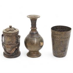 Three Chinese red and black cinnabar lacquered vases, together with three metalware examples, possibly 19th century Islamic, comprising vase, cup and covered vessel with floral handle; and a carved soapstone pig (7)