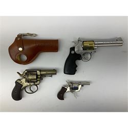 Early 20th century Flobert 5mm blank firing revolver with six-shot chamber, top venting, nickel plated with folding trigger No.118 L12.5cm overall; replica non-firing 'British Bulldog' revolver; and Windproof gas lighter inscribed 'Revolver-99 Spring and Autumn' in holster marked 'Star-Line'