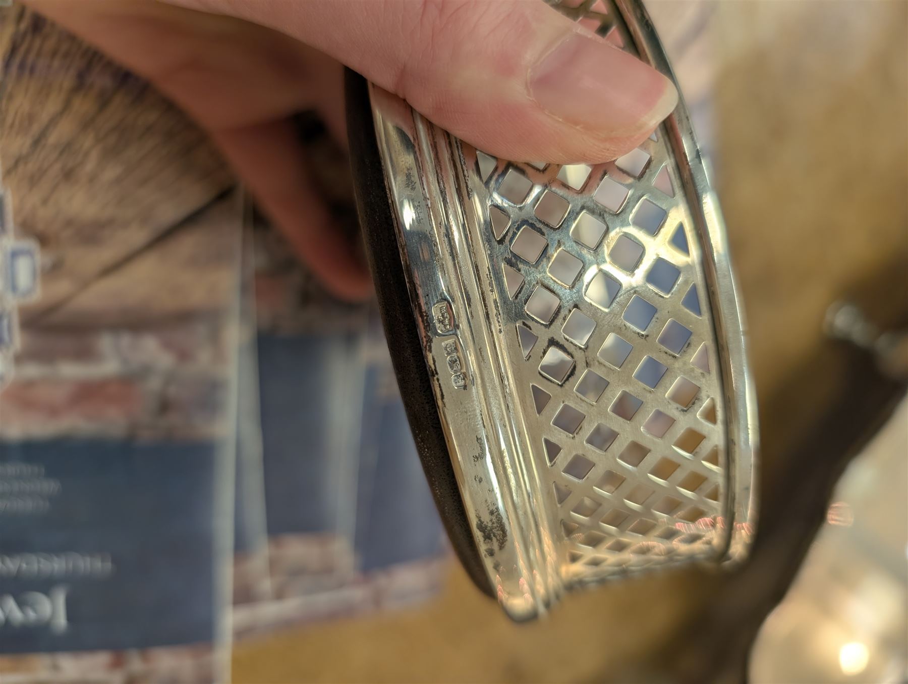 Two silver mounted bottle coasters, the larger example with latticework sides, hallmarked Mappin & Webb Ltd, Birmingham 1993, the smaller example with pierced sides, hallmarked W I Broadway & Co, Birmingham 1998, largest D12cm