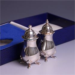 Pair of silver cruets, of baluster form and upon four pad feet, hallmarked Laurence R Watson & Co, Birmingham 1993, together with a set of six silver handled tea knives, hallmarked Barker Brothers Silver Ltd, Sheffield 1955, both in fitted cases