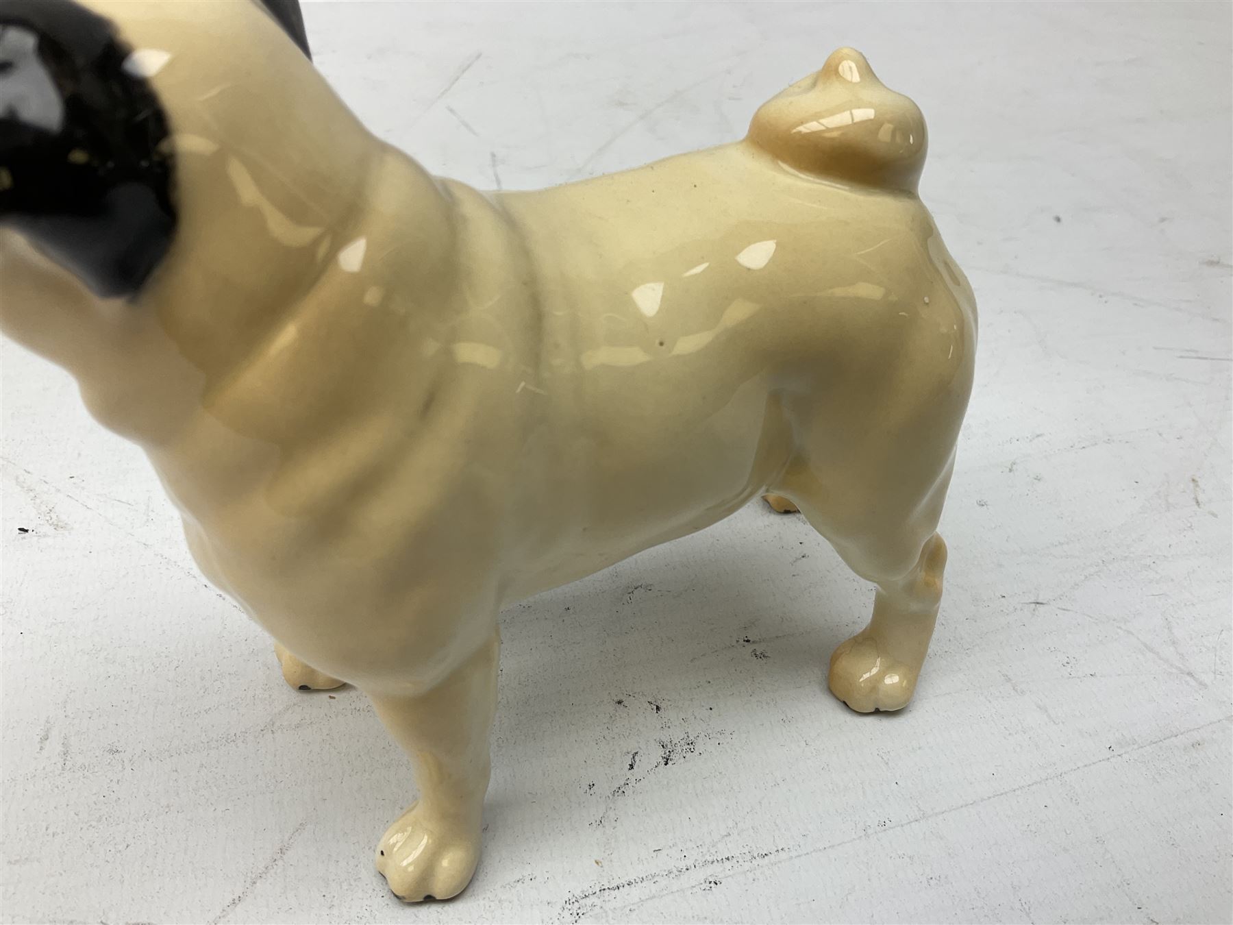 Three Beswick models comprising Hereford Bull no 949, 'CH Cutmil Cupie' Pug, and bay Shire horse, all with printed marks beneath