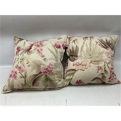 Five scatter cushions, two with floral decoration and three red, etc
