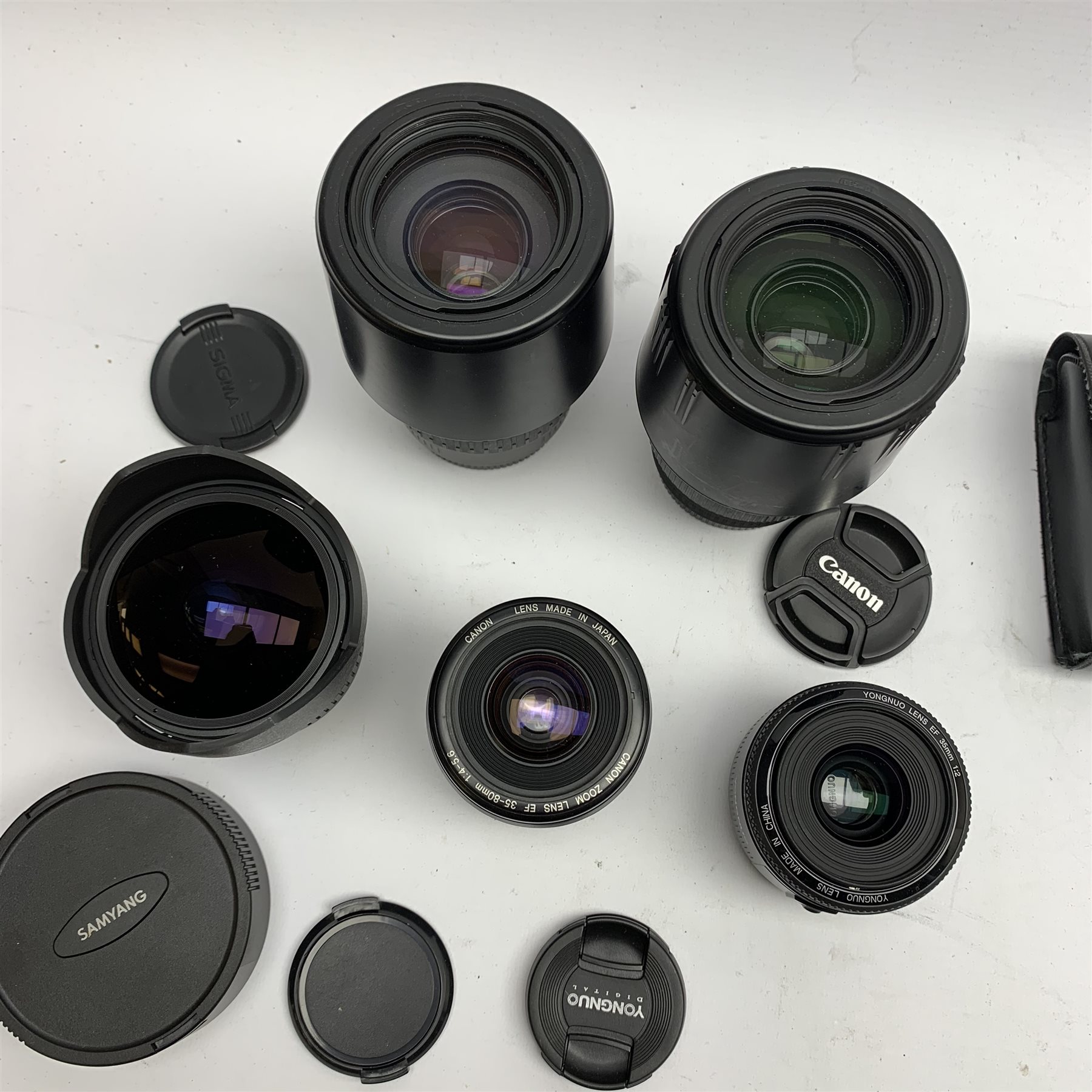Two Canon camera bodies 'Canon EOS 350D Digital' and 'Canon EOS 1000', five camera lenses including Sigma, Yongnuo and Canon and various other camera accessories 