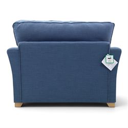 Contemporary blue small sofa bed, shaped arms with loose seat cushions, stowed bed beneath, raised on light wood feet