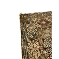 Caucasian indigo ground rug, the field decorated with geometric motifs within geometric pattern borders 