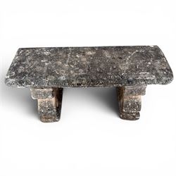 Weathered cast stone three-piece garden bench, with rectangular seat with egg-and-dart moulded edge, raised on end supports decorated with S-scrolls and fruiting vines