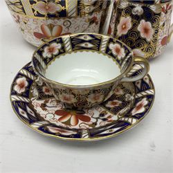 Royal Crown Derby 2451 Imari pattern, comprising four cups and saucers, milk jug, dish and another cups and saucer, all with printed marks beneath  