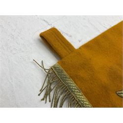 Two replica German Luftwaffe trumpet banners, one heavily silver wire embroidered with Luftwaffe eagle in a wreath, on an amber, white and black rayed background, , with silver wire tasselled border and four leather hanging loops, approx. 50 x 49cm; the other slightly larger heavily gold wire embroidered with the Luftwaffe eagle on a plain amber ground with gold wire tasselled border and two hanging loops (2)