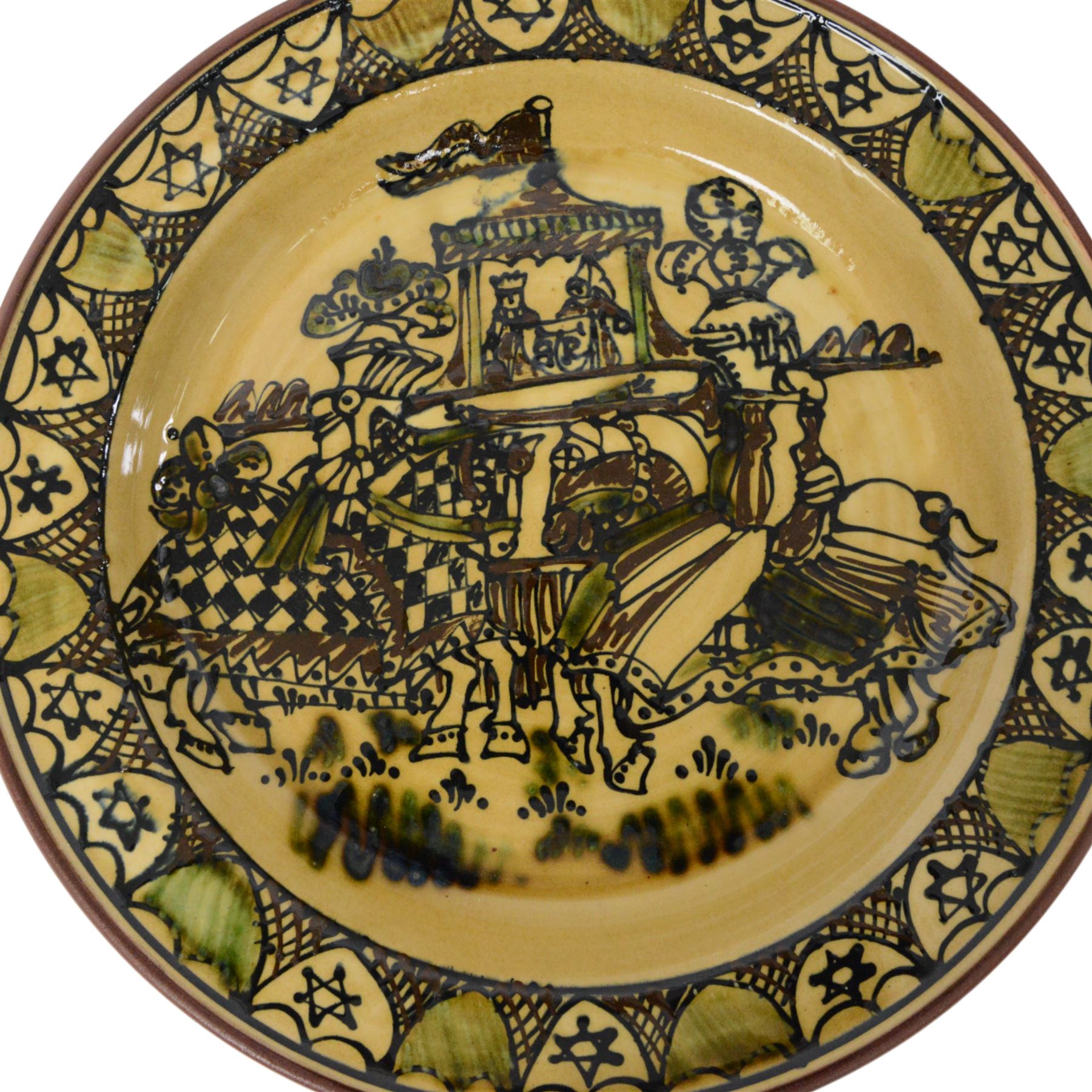 Wetheriggs Pottery of Penrith slipware Ivanhoe charger, the centre depicting a pair of jousting knights, with the King and Queen looking on, with impressed marks beneath, D51cm 