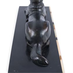 French Art Deco spelter figure of a recumbent dog on marble and onyx plinth, H14cm, L30cm