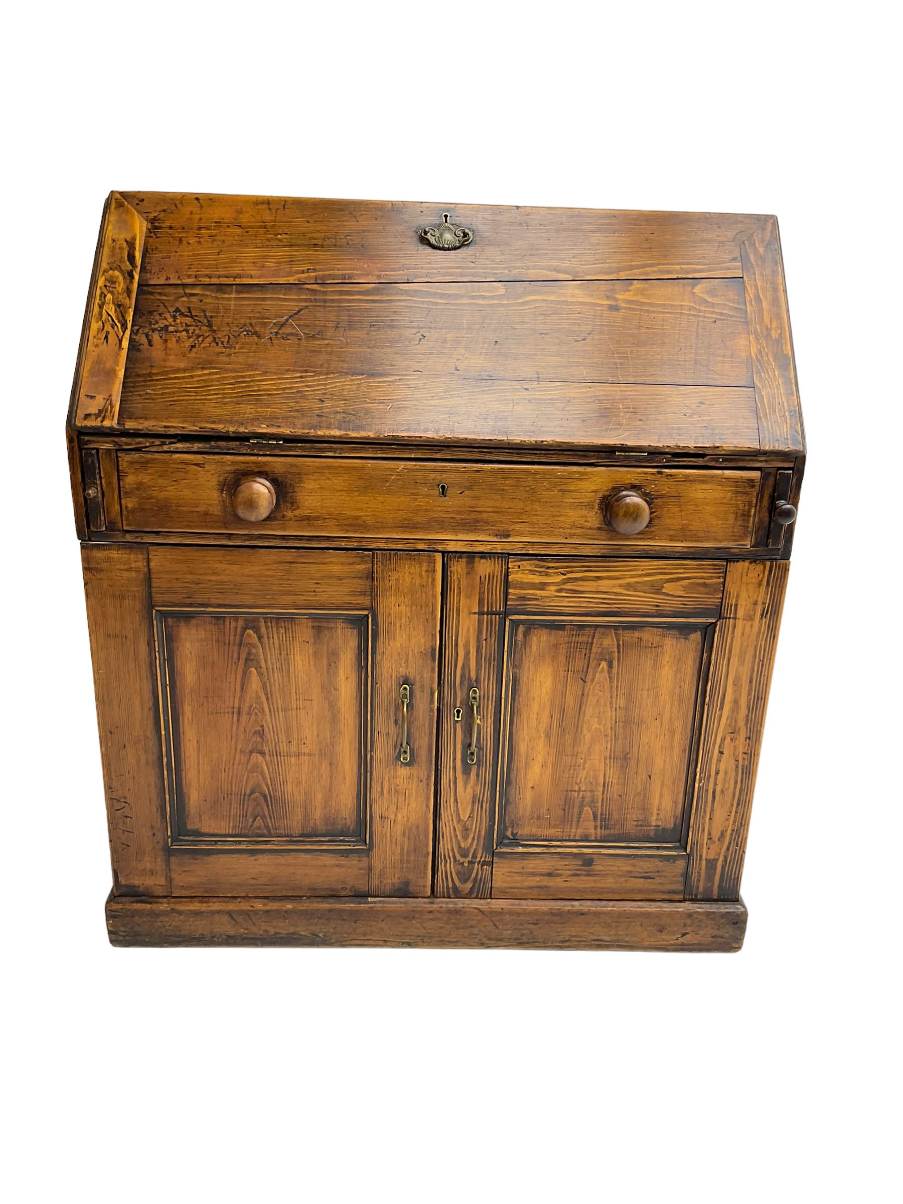 19th century waxed pine bureau, the fall front opening to reveal fitted interior with two drawers and five pigeonholes, base with single drawer over two panelled cupboard doors, on plinth base