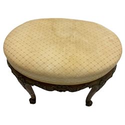 Late 19th century rosewood dressing table foot stool, oval form with over stuffed upholstered seat, the curved lower frieze rails decorated with foliage, acanthus leaf carved supports with scrolled terminals