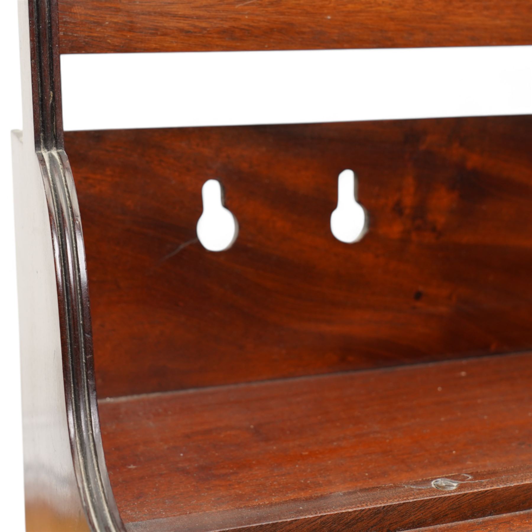 Mahogany two-tier book carrier, of rectangular section, with a single carrying handle over a shaped gallery 