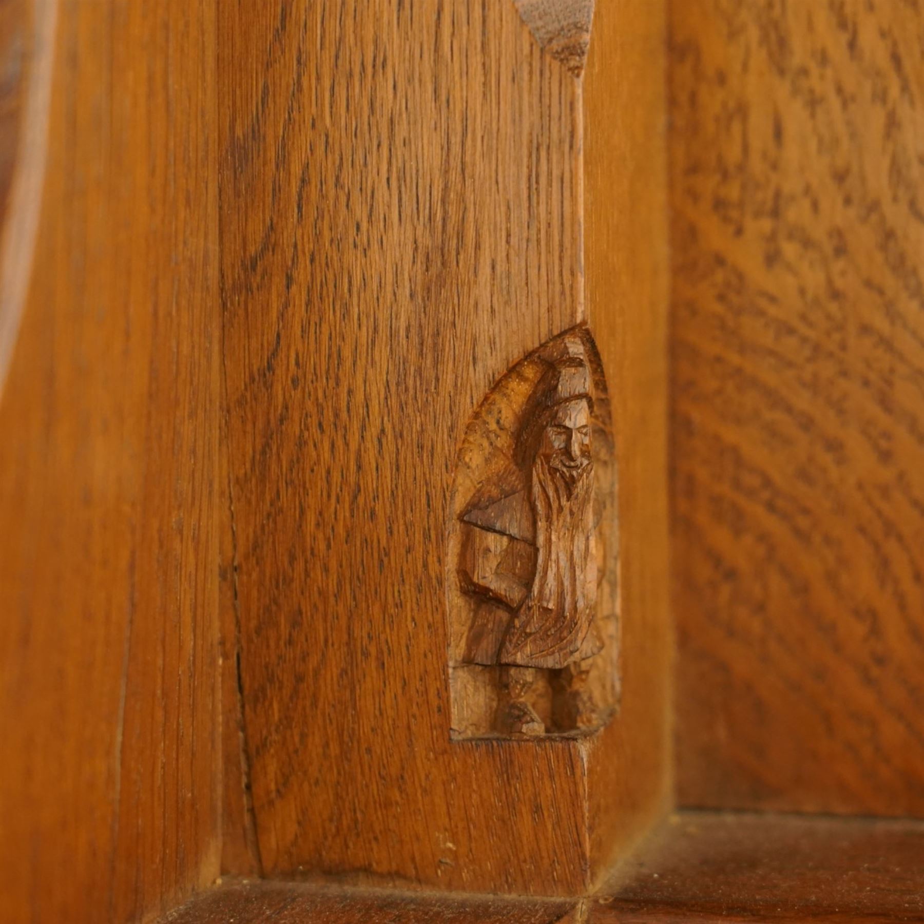 Gnomeman - adzed oak dodecagon dining table, the shaped top raised on a cruciform base with tooled brackets, terminating to four sledge feet, carved with gnome signature, by Thomas Whittaker, Littlebeck, Whitby