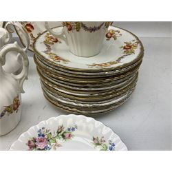 Quantity of Royal Albert tea wares to include 'Moss Rose' teapot, sucrier and saucers, together with teacups, saucers, side plates, jug etc decorated with orange, yellow and blue floral sprays with gilding upon plain ground, all stamped Royal Albert beneath