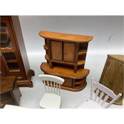 Doll's house wooden furniture - over twenty items including good quality pine Welsh dresser by Tony of Lincoln; tall 'glazed' bookcase; two-tier side cabinet; grand piano; bedside chest, mule chest, Canterbury; cradle; Georgian style hanging corner cupboard; dumb waiter; tables; chairs; rocking chair etc; various scales