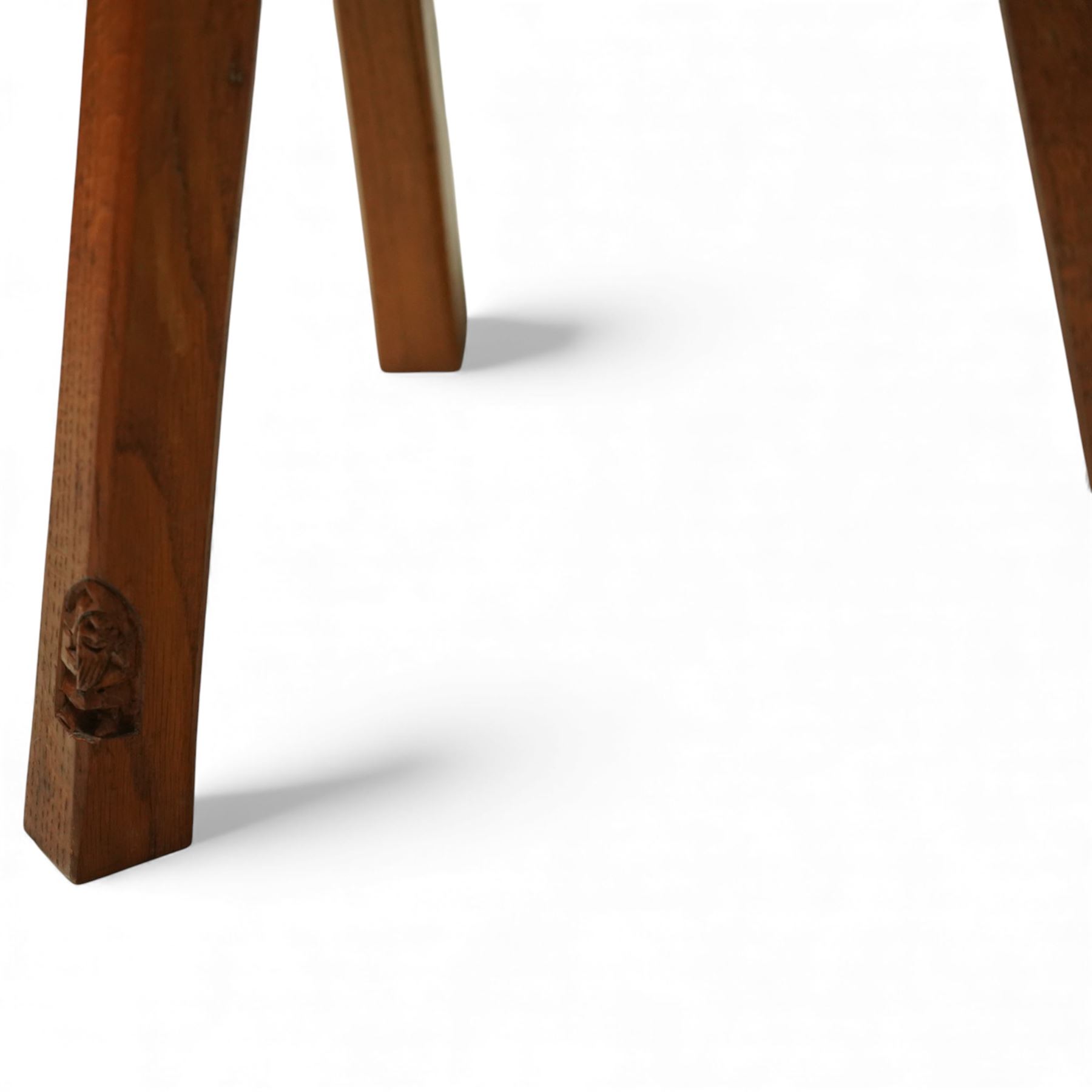 Gnomeman - oak Yorkshire rose milking stool, adzed surface with carving of a Yorkshire rose, exposed wedged through tenons, square legs with chamfered edges, with signature carving of a Gnome, by Thomas Whittaker of Littlebeck