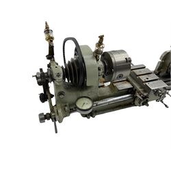 Early Myford M1 engineering lathe with a three jaw chuck, V belt pulley assembly, crosslide and tailstock.
3-1/8