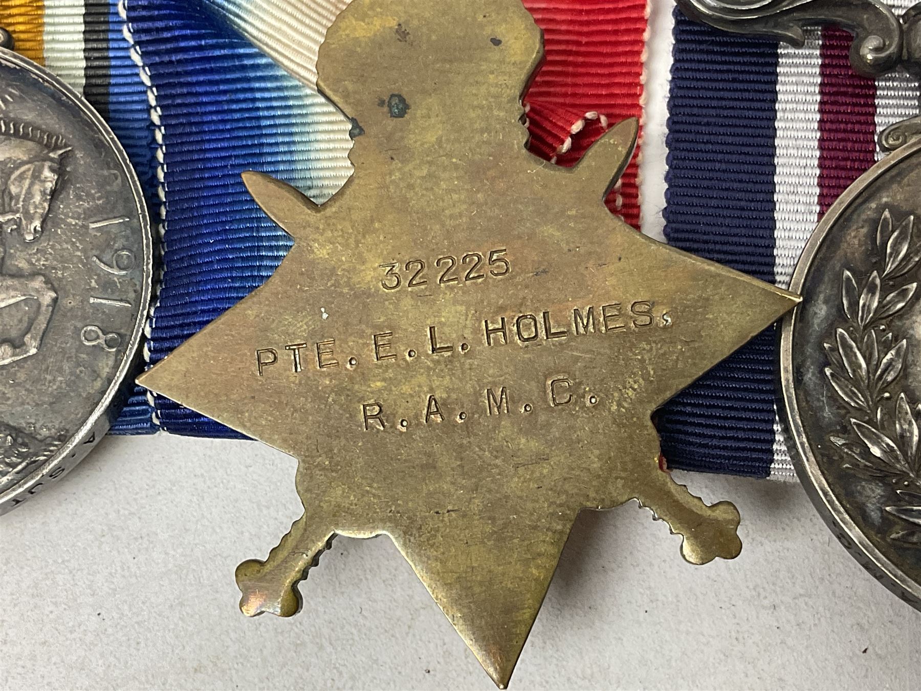 WW1 Military Medal KIA group of four comprising MM, British War Medal, 1914-15 Star and Victory Medal awarded to 32225 Pte. (later A.Sjt.) E.L. Holmes R.A.M.C., the MM inscribed 28F/A R.A.M.C.; all with ribbons; together with photocopied research material including newspaper article with presentation photograph, CWGC certificate,  London Gazette entry etc