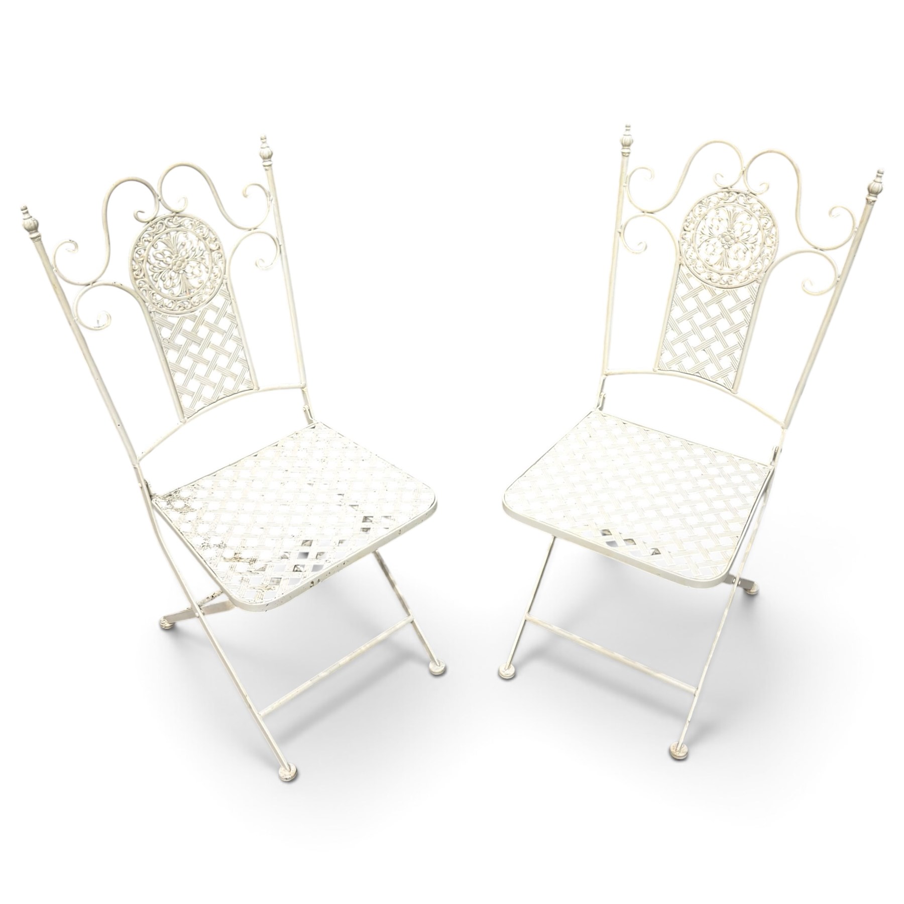 Pair of Victorian design wrought metal folding garden chairs, scrolled cresting rail over pierced foliate medallion, lattice back and seat on X-frame folding base
