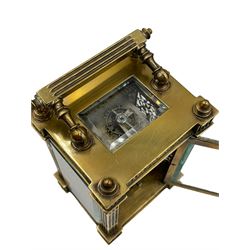 French - Matching pair of Edwardian 8-day timepiece carriage clocks with bevelled rectangular glass panels and overlaid friezes in gilt repousse work with fretted dial masks,  circular enamel chapter ring with Arabic numerals and steel spade hands, both clocks with single train movements, one movement with a jewelled cylinder platform escapement and the other with a jewelled and silvered lever platform escapement.
No Keys.
