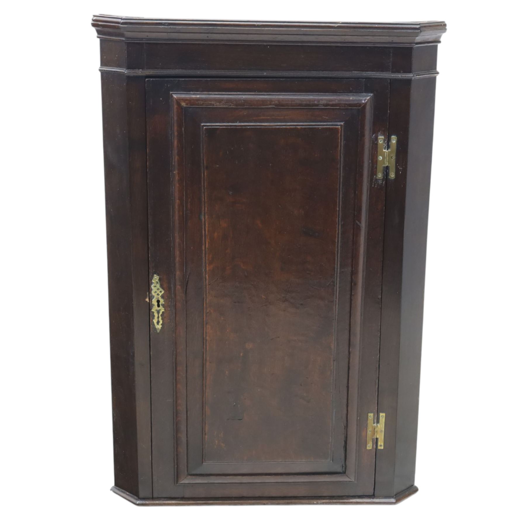 George III country oak corner cupboard, enclosed by single cushion panelled door, brass H hinges