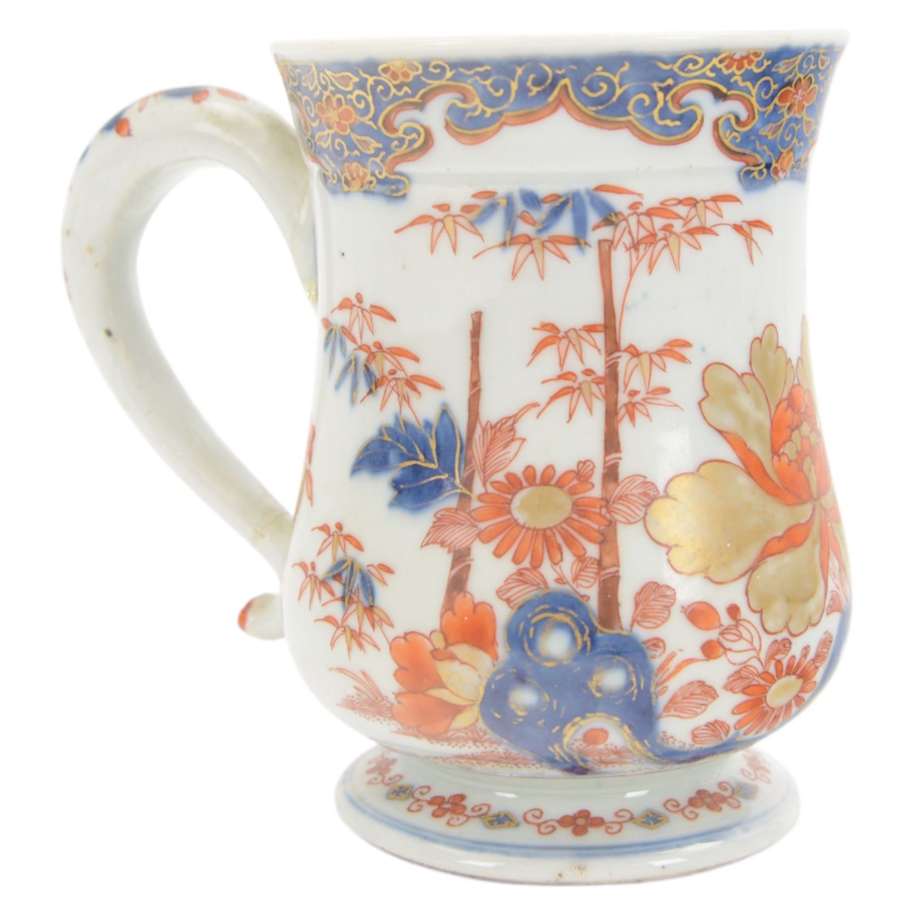 Pair of 18th century Chinese export tankards, each of bellied form with curved handle and circular foot, decorated in the Imari palette with peonies, chrysanthemums and bamboo, H12.5cm