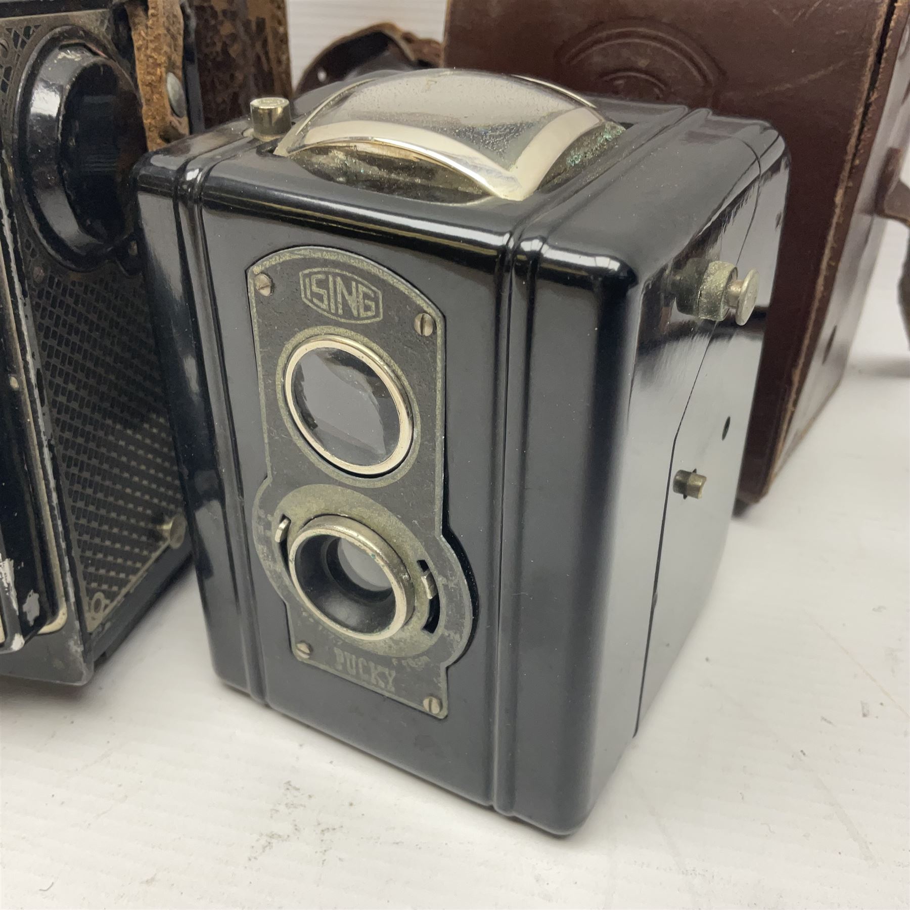 Franke & Heidecke Rolleicord twin lens camera, serial number 012706 with Heidoscop-Anastigmat f=7.5cm' lens and a 'Carl Zeiss Jena Triotar 1:4.5 f=7.5cm' lens, serial no 1474898, together with three similar cameras, including SEM TLR, serial no 420218, Ising Pucky box and Ferrania Elioflex, three in leather carry cases