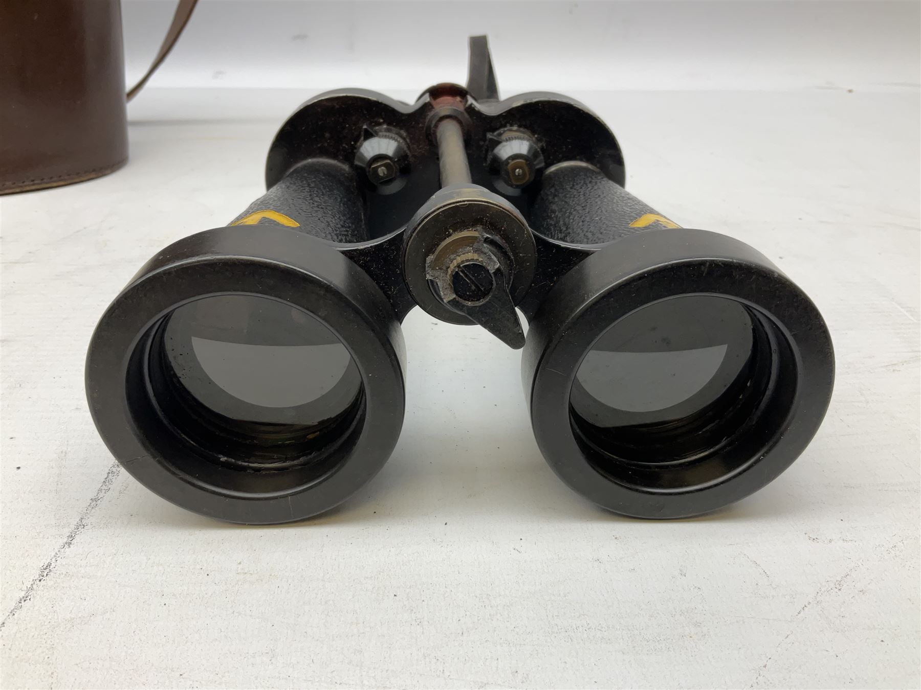 Pair of WWII Barr and Stroud CF41 naval binoculars,  A.P.1900A, with painted broad yellow military arrows, engraved Barr & Stroud, 7X CF 41, Glasgow & London, Serial no. 62984 with leather lens covers and case, H24cm